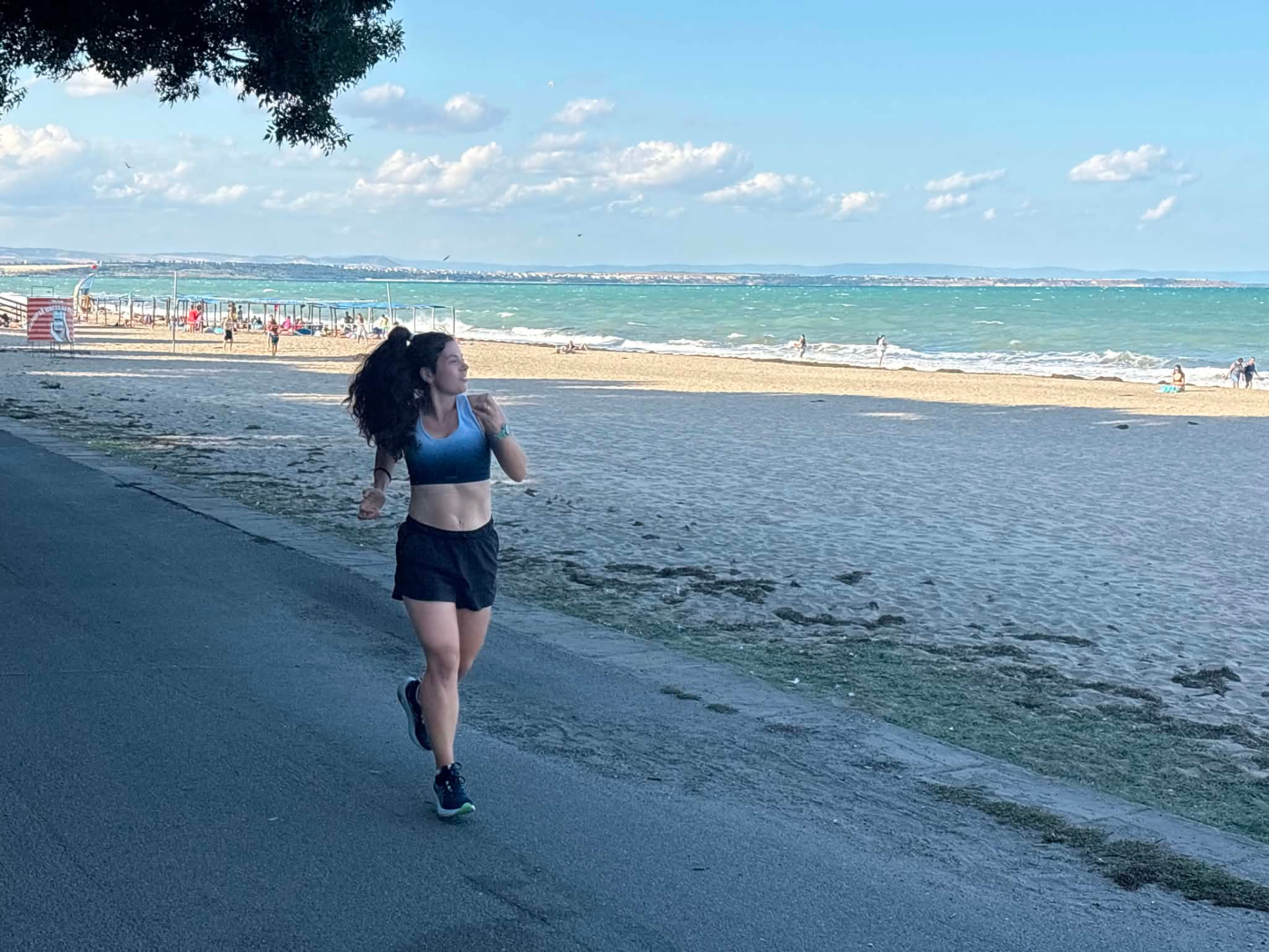 Runner on the beach path along the Burgas coast